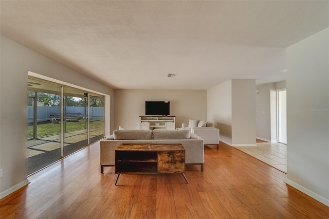 living room with light hardwood / wood-style floors