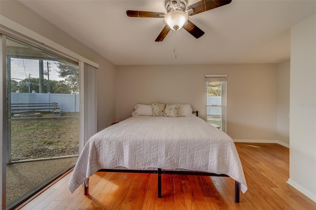 bedroom with ceiling fan and light wood-type flooring