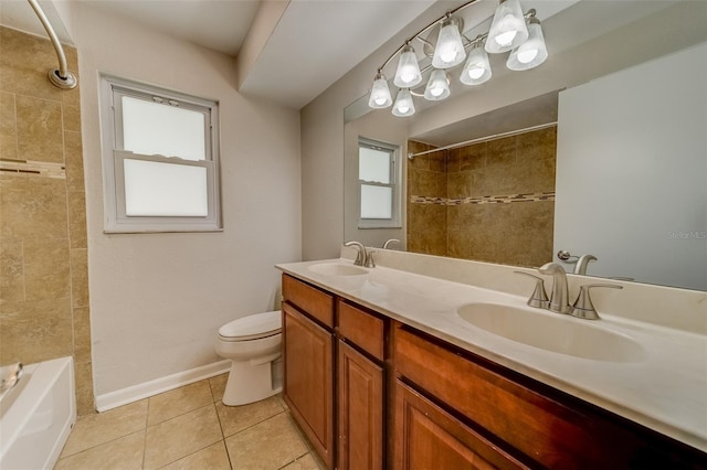 full bathroom featuring tile patterned floors, vanity, tiled shower / bath combo, and toilet