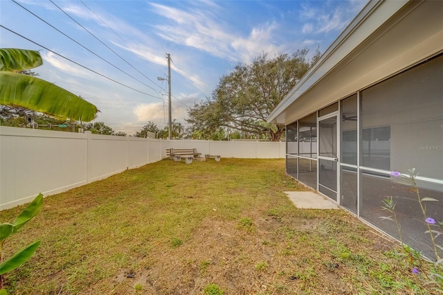 view of yard with a sunroom