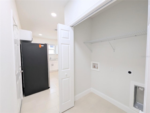 washroom featuring sink, hookup for a washing machine, and electric dryer hookup