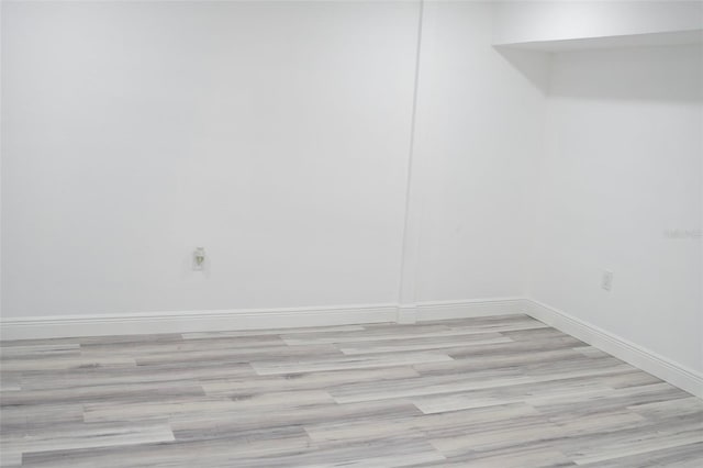 unfurnished room with light hardwood / wood-style floors