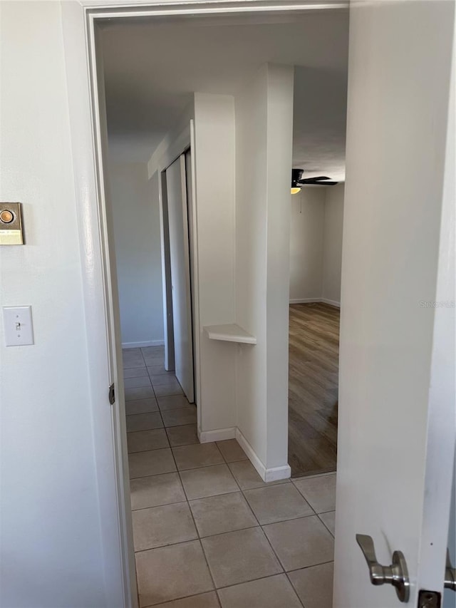 corridor with light tile patterned floors