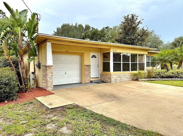 ranch-style home featuring a garage