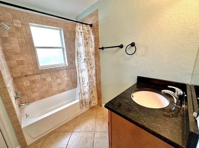 bathroom with tile patterned flooring, shower / bath combo, and vanity