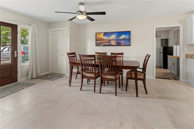 dining space with ceiling fan