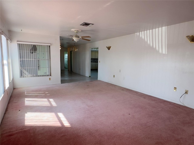 spare room with carpet flooring and ceiling fan