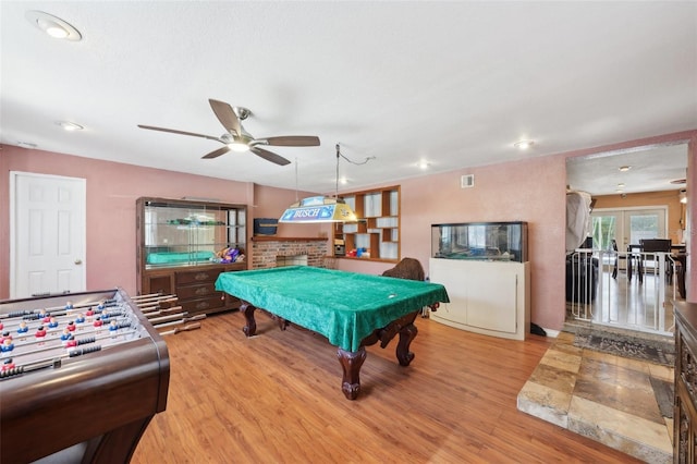 game room with french doors, hardwood / wood-style flooring, ceiling fan, and pool table