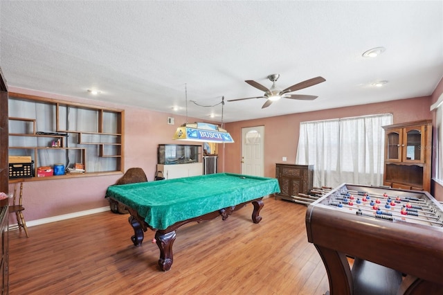 game room with hardwood / wood-style flooring, ceiling fan, and billiards