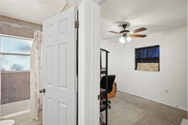 home office with ceiling fan and light colored carpet