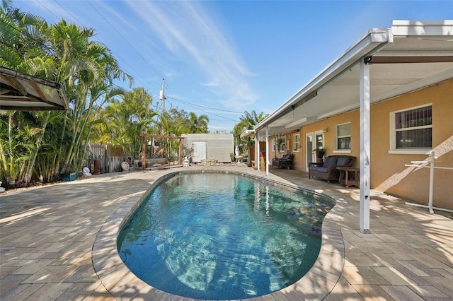 view of pool featuring a patio