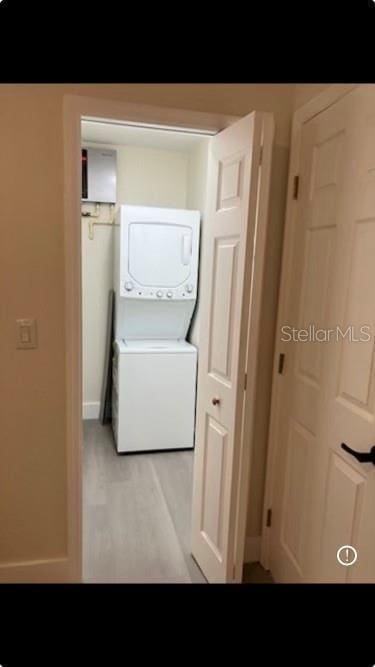 laundry area featuring stacked washer and dryer