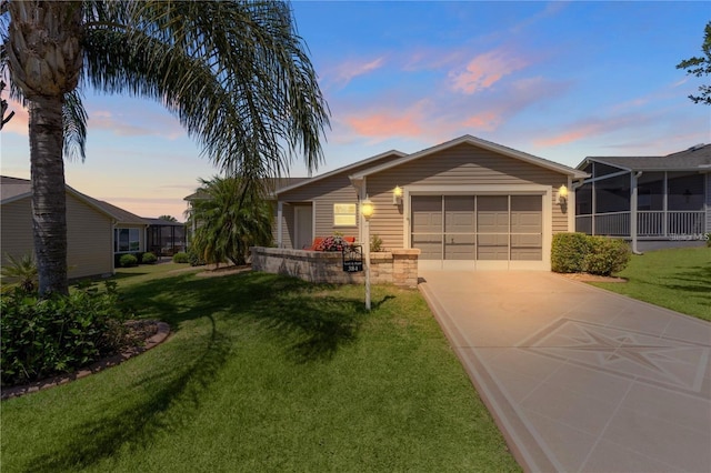 ranch-style home with a lawn