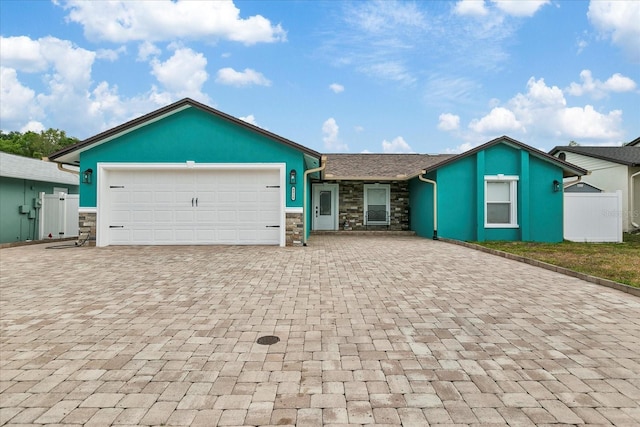 ranch-style house featuring a garage