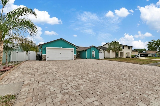 single story home featuring a garage