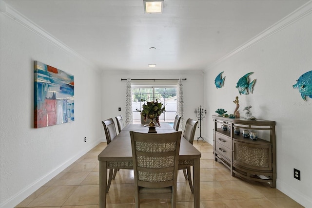 dining area featuring light tile patterned flooring and ornamental molding