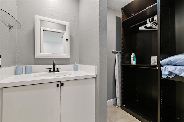 bathroom with tile patterned flooring and vanity