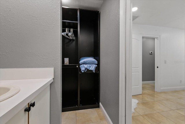 bathroom featuring vanity and tile patterned floors