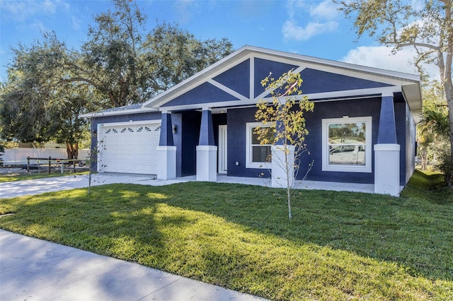 view of front facade with a garage and a front yard