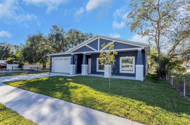 view of front of home with a garage and a front yard