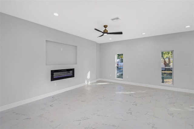 unfurnished living room featuring ceiling fan