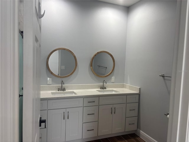 bathroom with vanity and hardwood / wood-style flooring