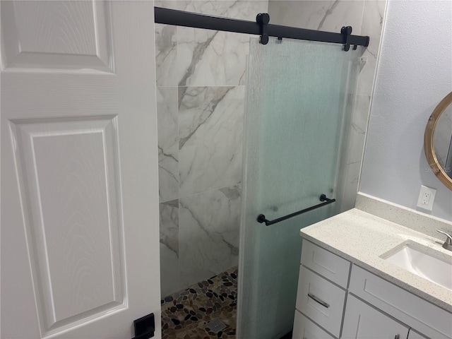 bathroom with vanity and an enclosed shower