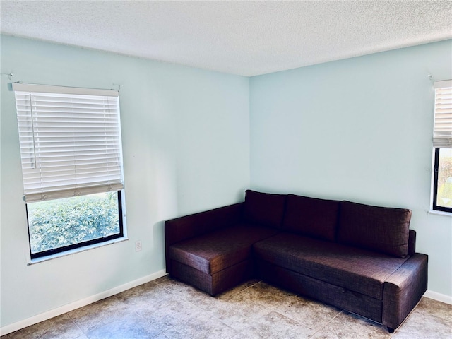 unfurnished living room with a textured ceiling