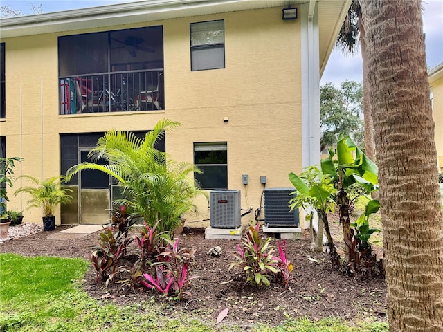 rear view of property featuring cooling unit