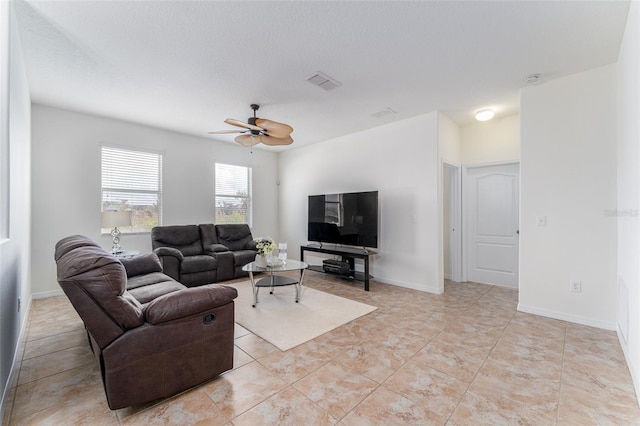 living room featuring light tile patterned floors and ceiling fan