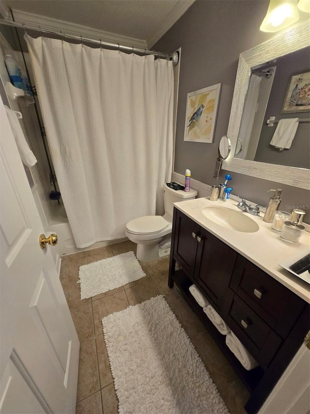 bathroom featuring tile patterned flooring, vanity, and toilet