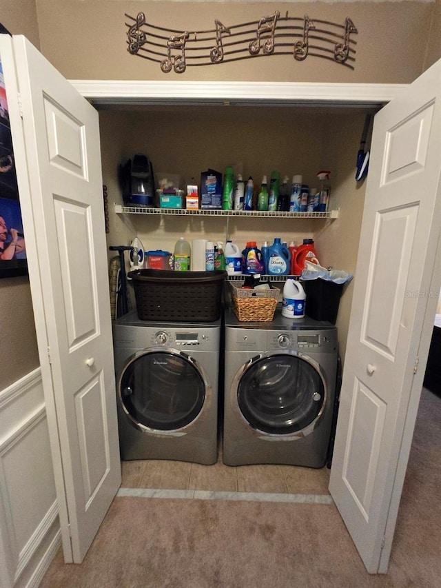 washroom featuring light colored carpet and washing machine and dryer