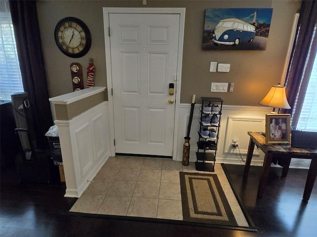 foyer entrance with tile patterned flooring