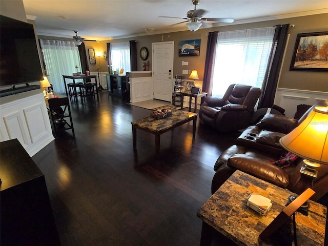 living room featuring crown molding, dark hardwood / wood-style floors, and ceiling fan