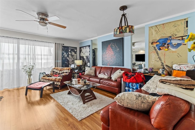 living room featuring ceiling fan and hardwood / wood-style floors