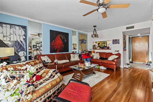 living room with ceiling fan and hardwood / wood-style floors