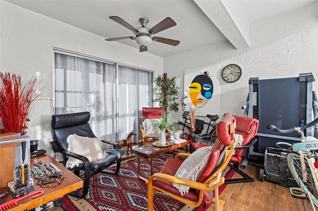 interior space featuring wood-type flooring and ceiling fan