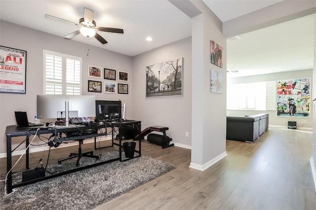 office space with hardwood / wood-style flooring and ceiling fan