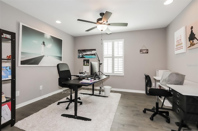 office space with ceiling fan and dark hardwood / wood-style floors