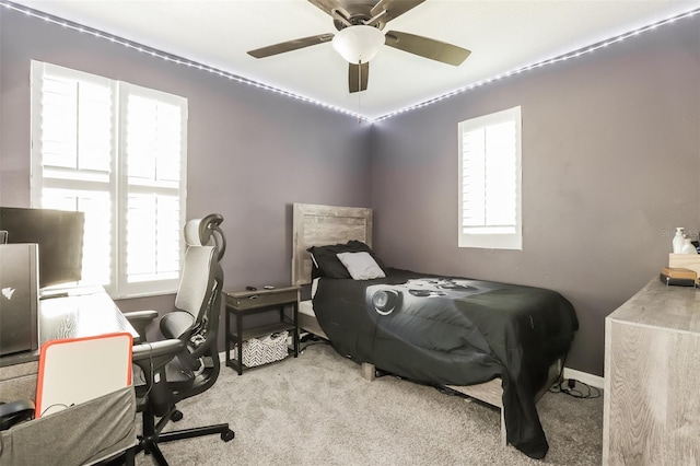 bedroom with light colored carpet and ceiling fan