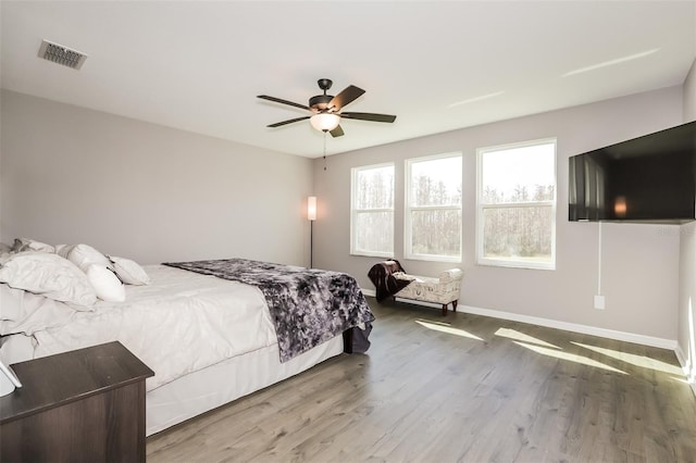 bedroom featuring hardwood / wood-style floors and ceiling fan