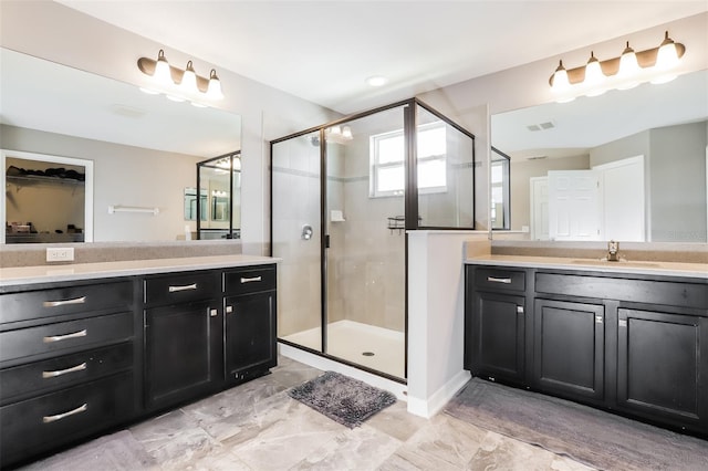 bathroom with vanity and walk in shower