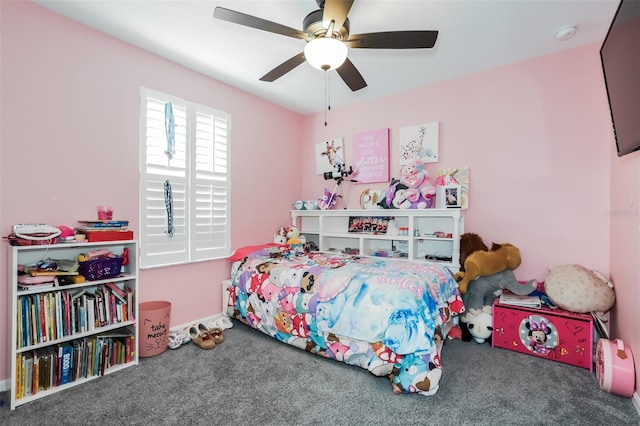 bedroom featuring dark colored carpet and ceiling fan