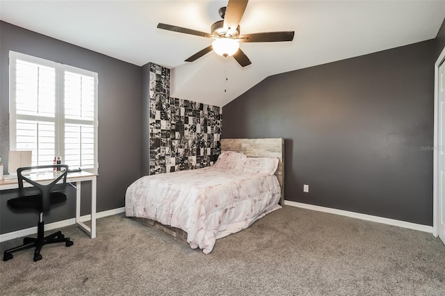 carpeted bedroom featuring ceiling fan and lofted ceiling