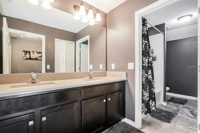 bathroom with vanity, toilet, and curtained shower