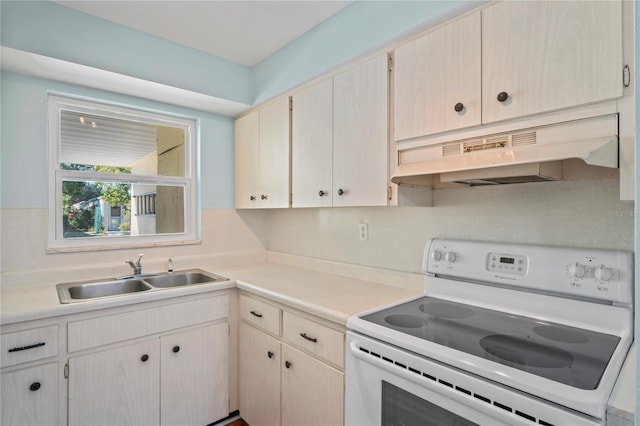 kitchen with white range with electric stovetop and sink