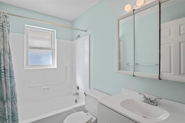 full bathroom with vanity, shower / tub combo, and toilet