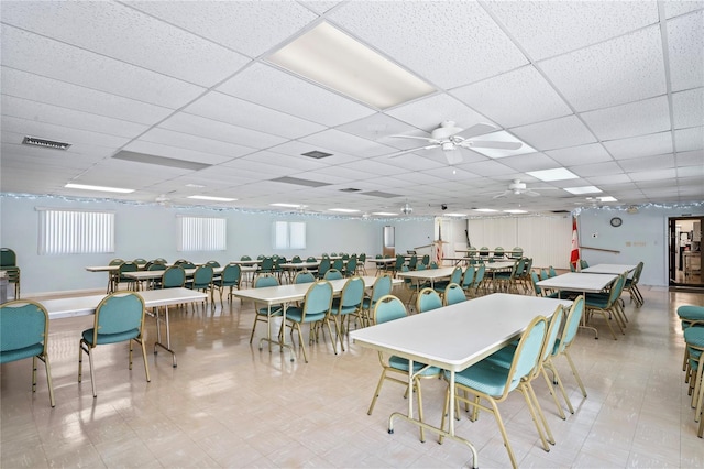 dining space featuring a paneled ceiling and ceiling fan