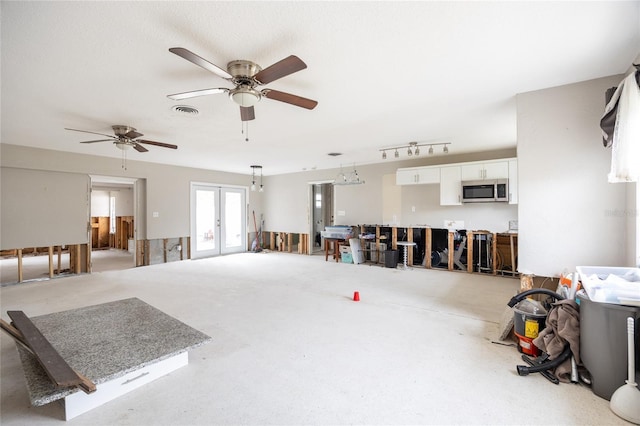 misc room with french doors and ceiling fan