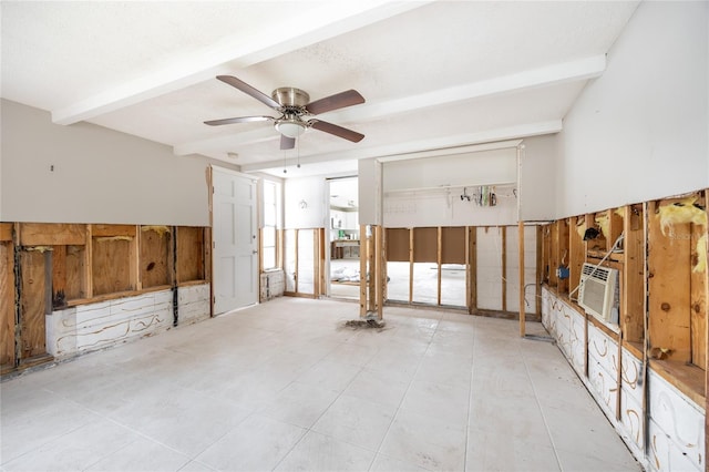 unfurnished room with cooling unit, ceiling fan, beamed ceiling, and a textured ceiling